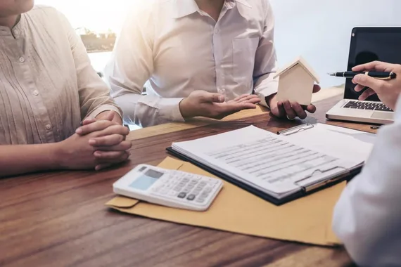 Borrowers going over the loan process for short term private money loans