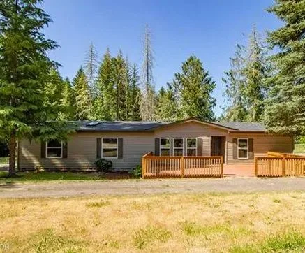 A manufactured home on land, financed and renovated